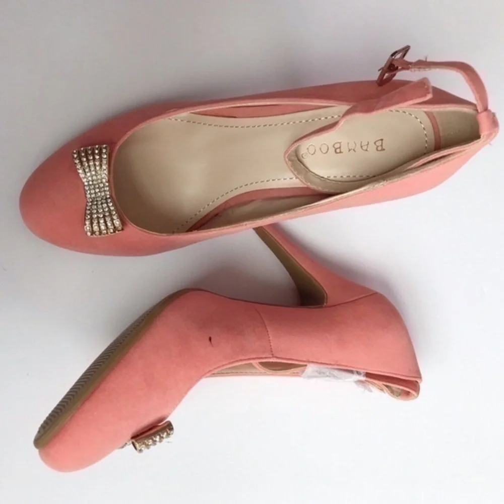 Pink faux suede bamboo heels with bow